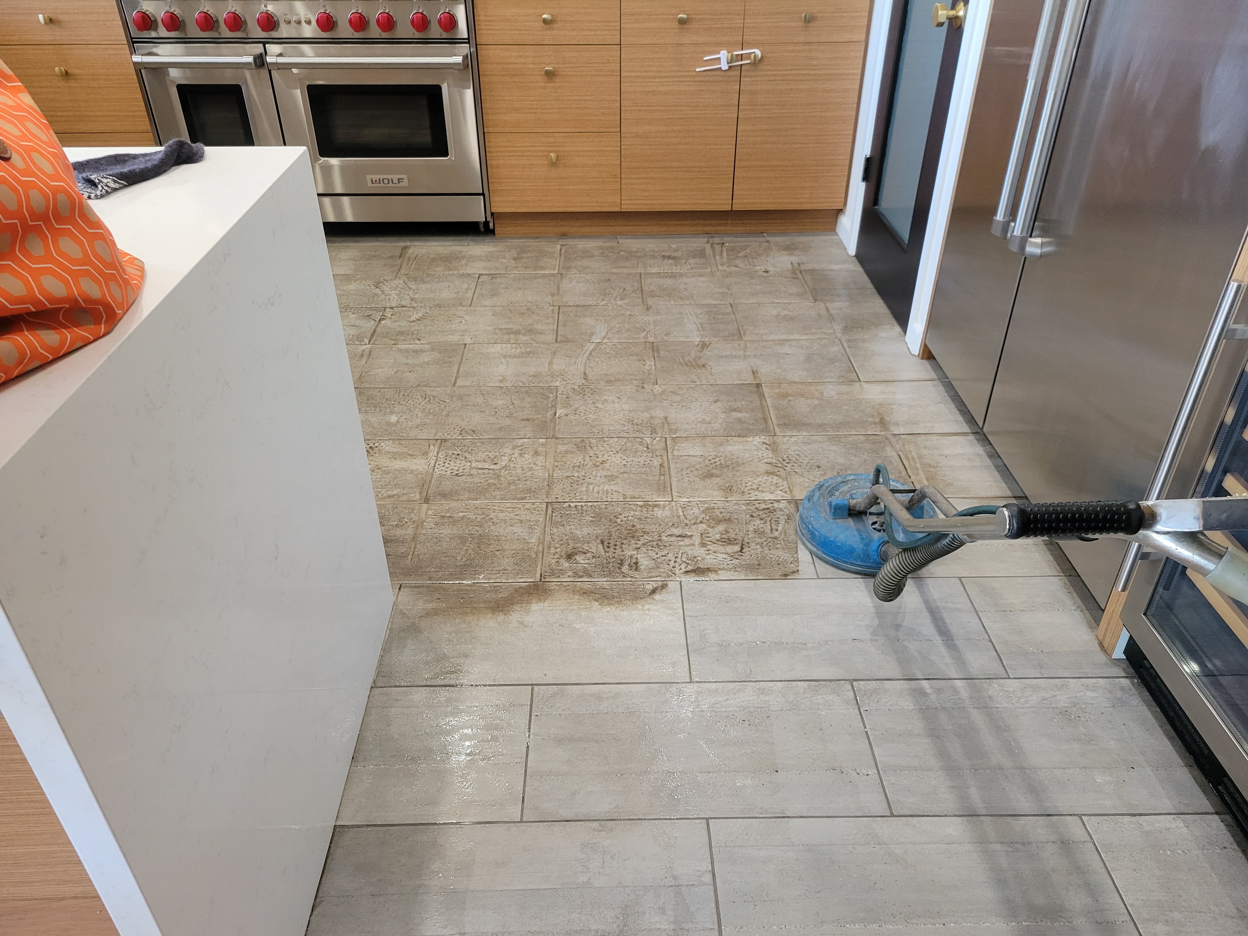 Tile floor with cleaned grout lines